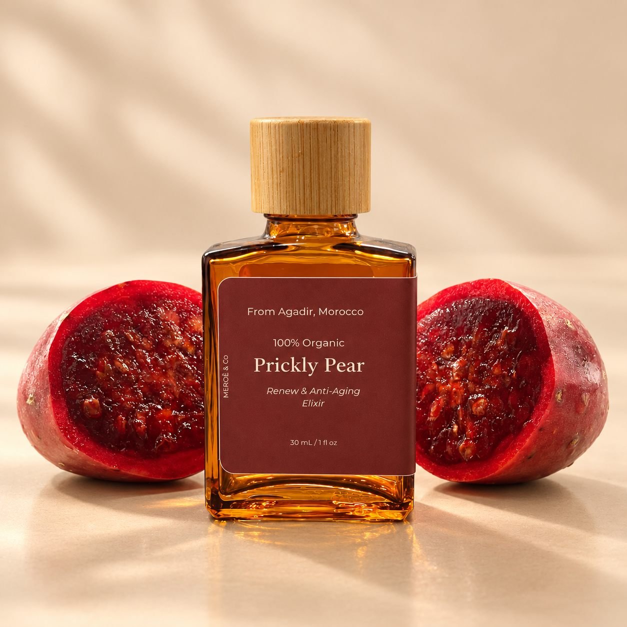 Prickly Pear elixir between two halved fruits